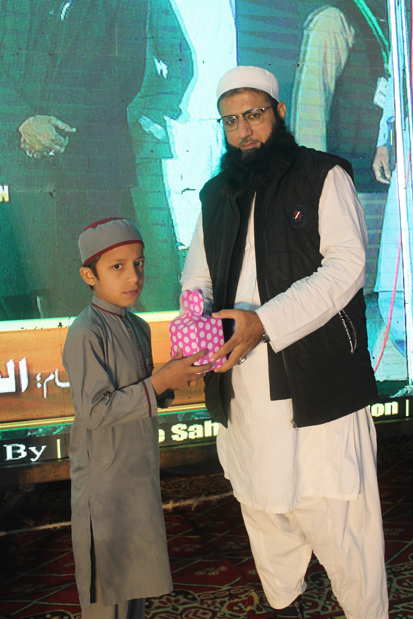 Two people holding hands